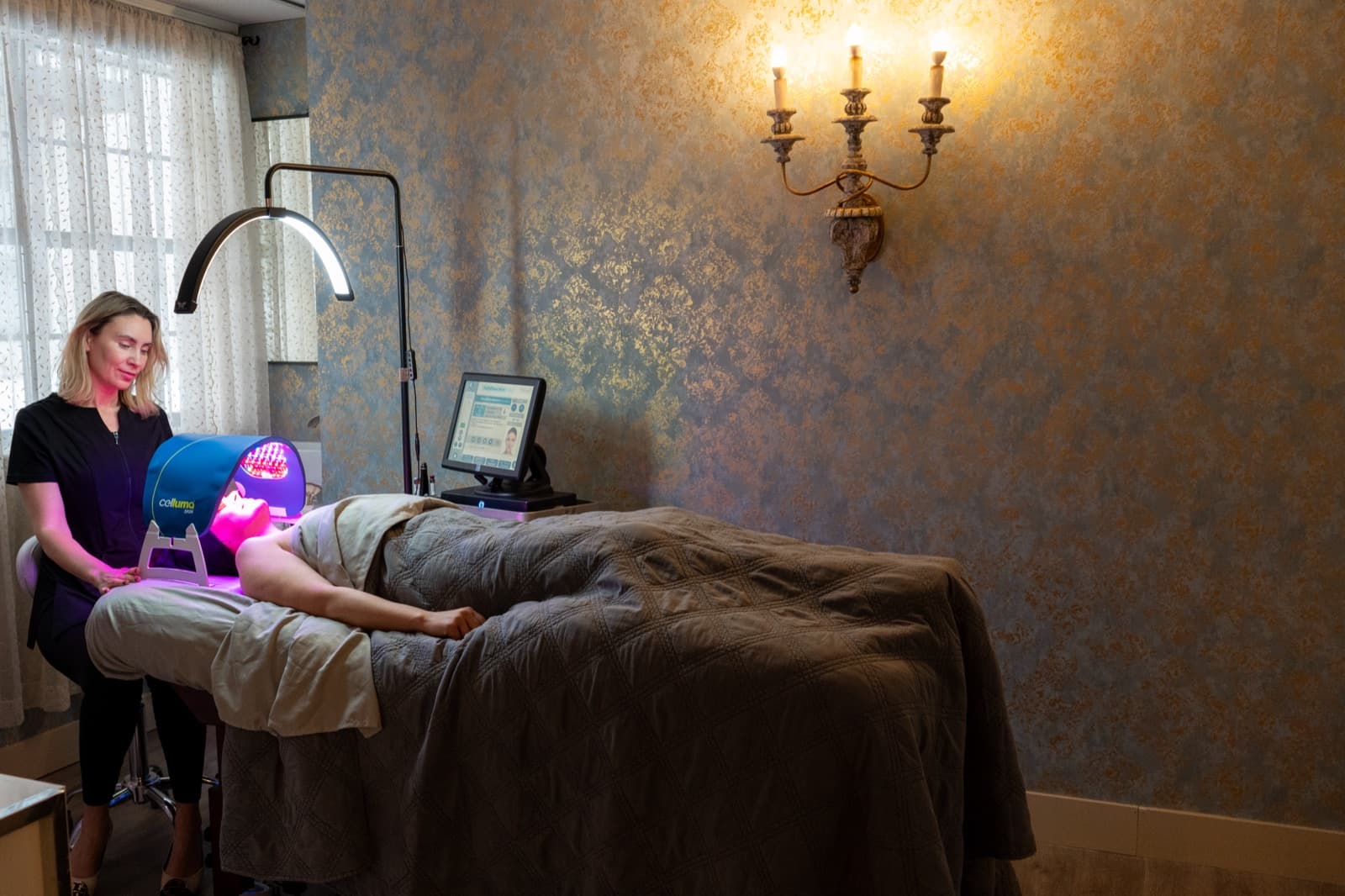 LED Celluma acne treatment in the gold-walled facial room at LNO Boutique in Centennial, Denver
