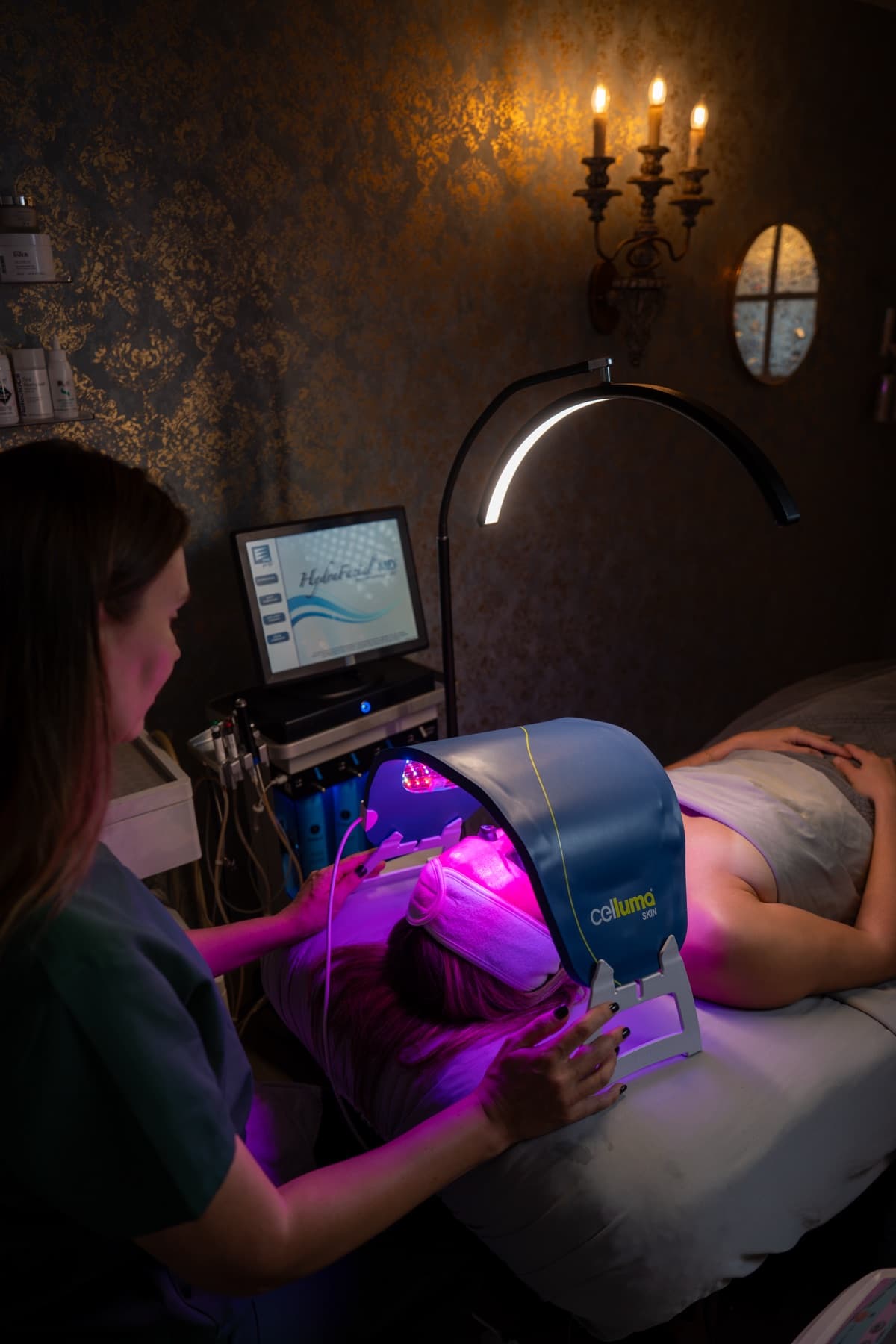 Blue-light LED acne treatment under the Celluma panel beside the HydraFacial MD at LNO Boutique in Centennial, Colorado