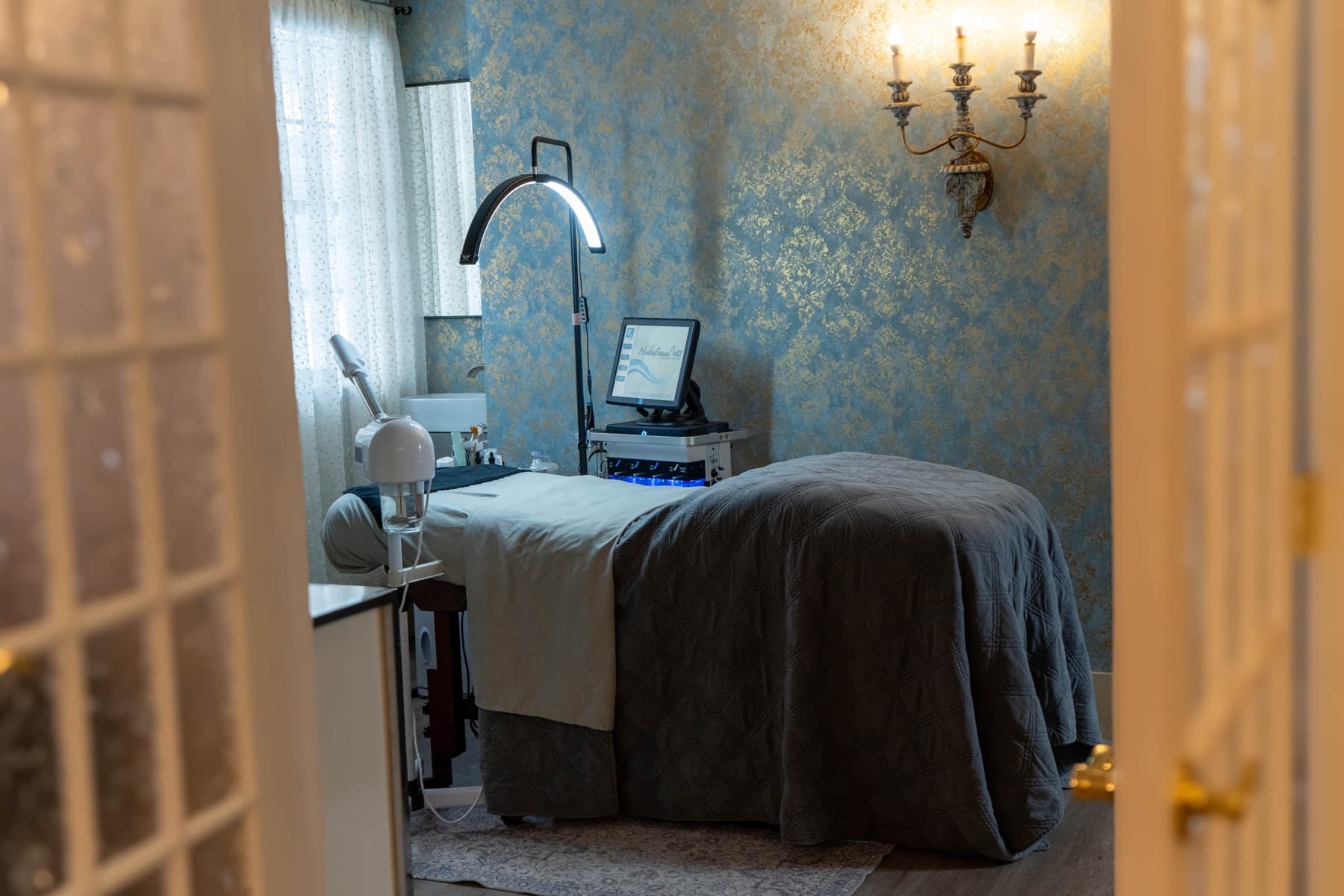Private treatment room seen through French doors, where sweaty hands are treated with Botox at LNO Boutique med spa in Centennial