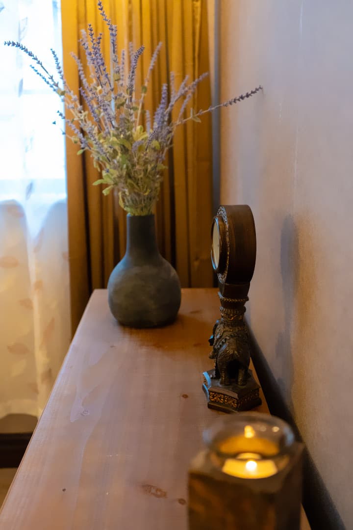 Console with lavender and a candle in the med spa corridor at LNO Boutique in Centennial, Denver