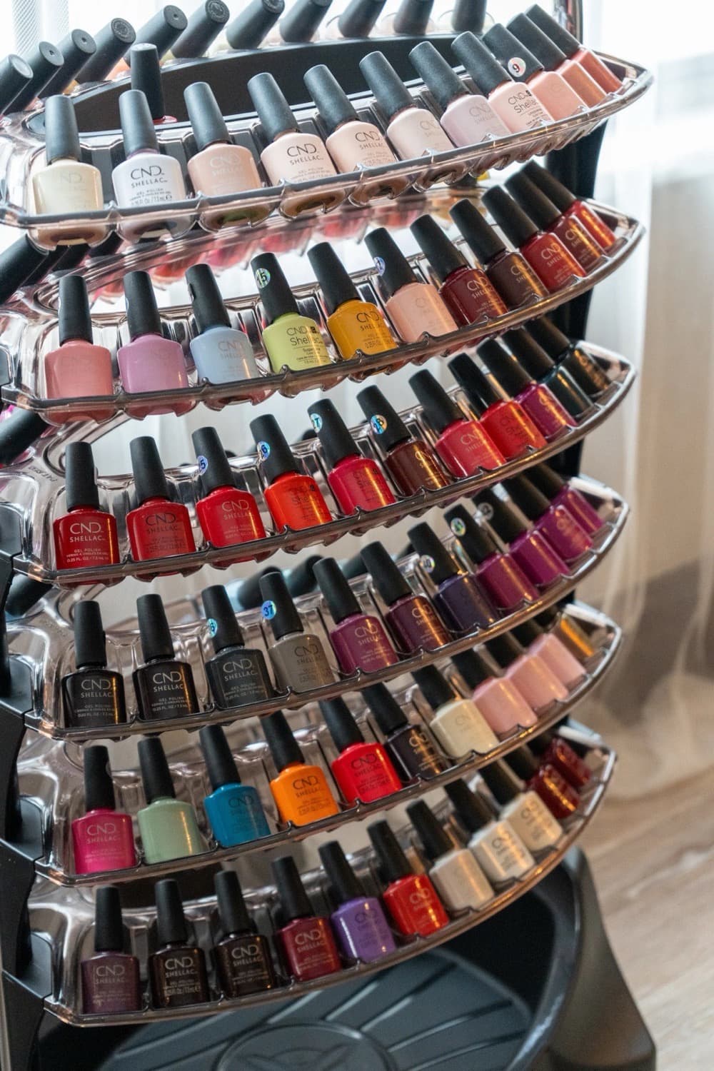 The CND Shellac colour rack at LNO Boutique nail salon in Centennial, Denver