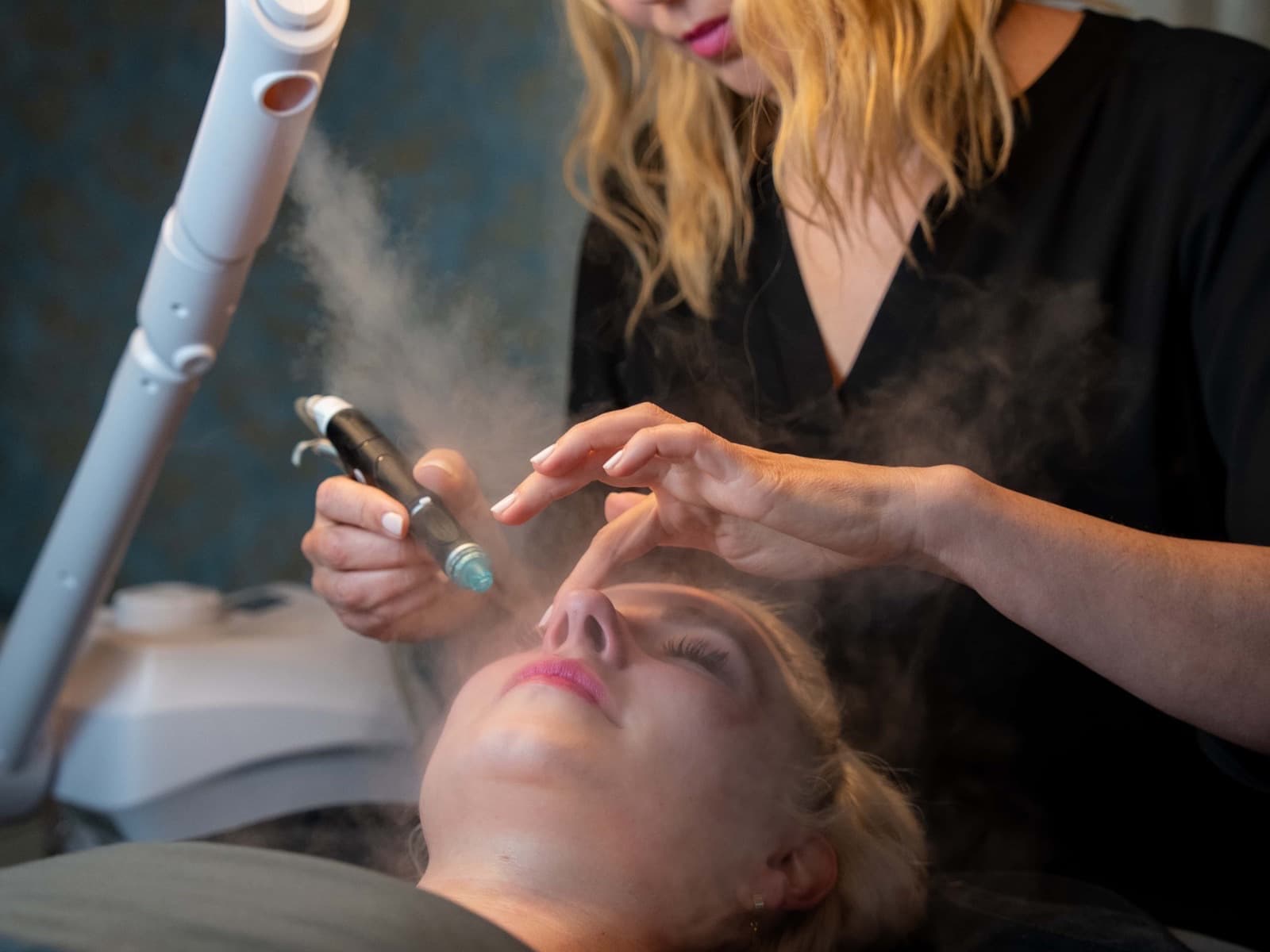 HydraFacial vortex handpiece at work on a guest's face at LNO Boutique in Centennial, Colorado