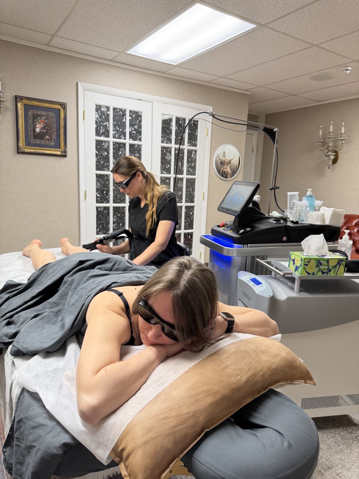 Full back laser hair removal in progress with the Cynosure Elite iQ in the treatment room at LNO Boutique med spa in Centennial, Denver