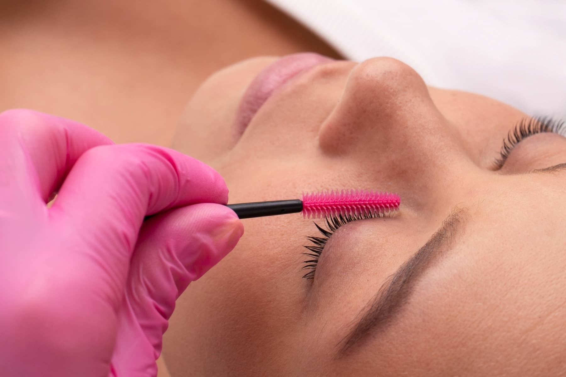 Lashes being brushed through after a lash lift and tint at LNO Boutique in Centennial, Denver