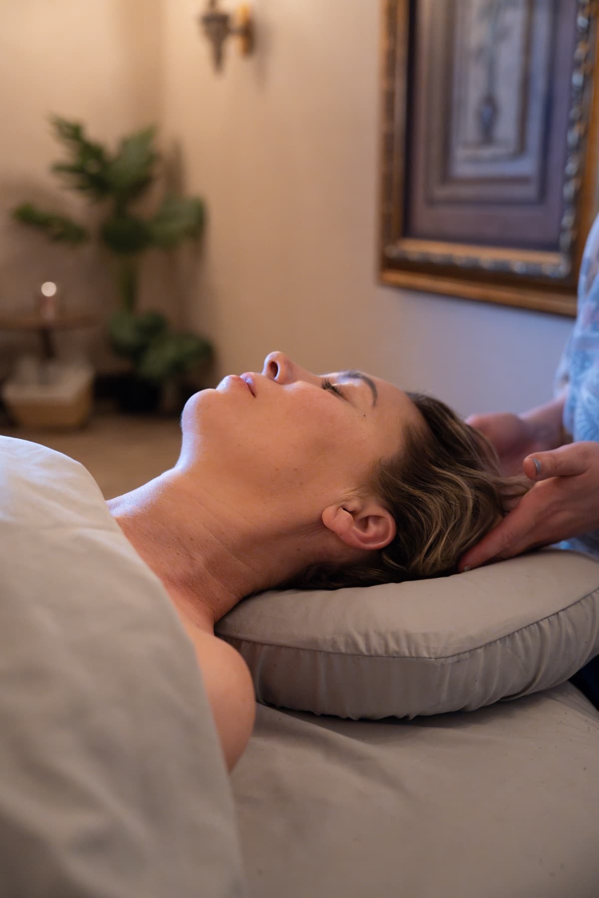 Guest relaxing face up during a facial and neck massage at LNO Boutique in Centennial, Denver