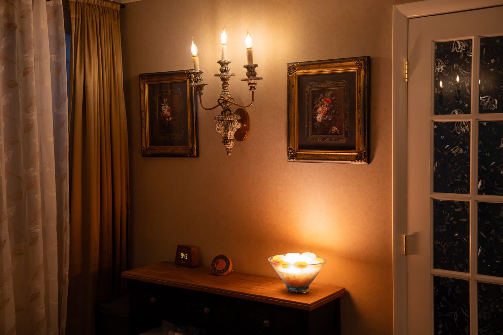 Candle sconce and warm lamp light in a treatment room at LNO Boutique day spa, Centennial