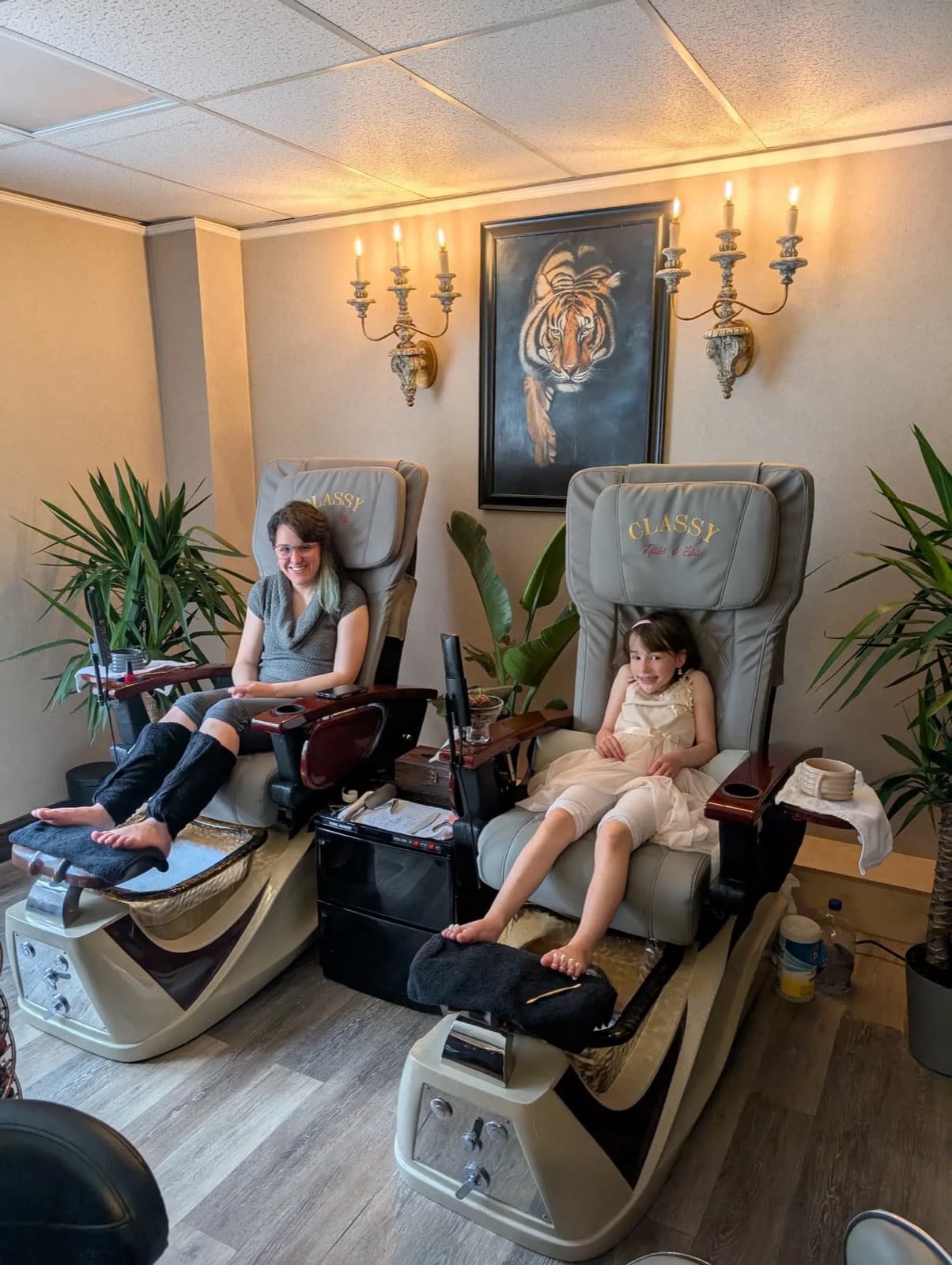 Mother and daughter side by side in the pedicure chairs during a Mommy and Me spa day at LNO Boutique in Centennial