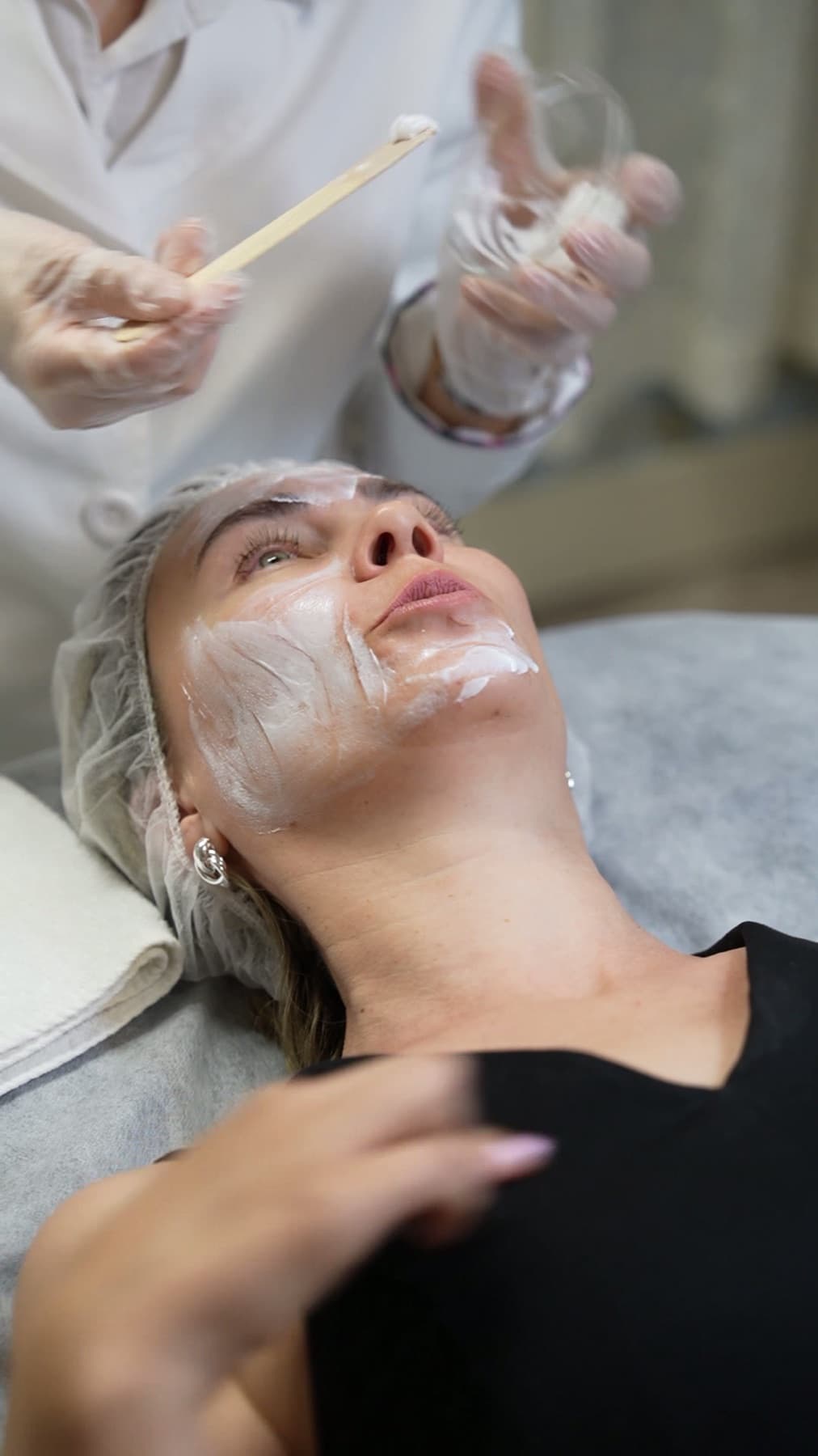 Licensed aesthetician applying a peel in layers at LNO Boutique med spa in Centennial, Colorado