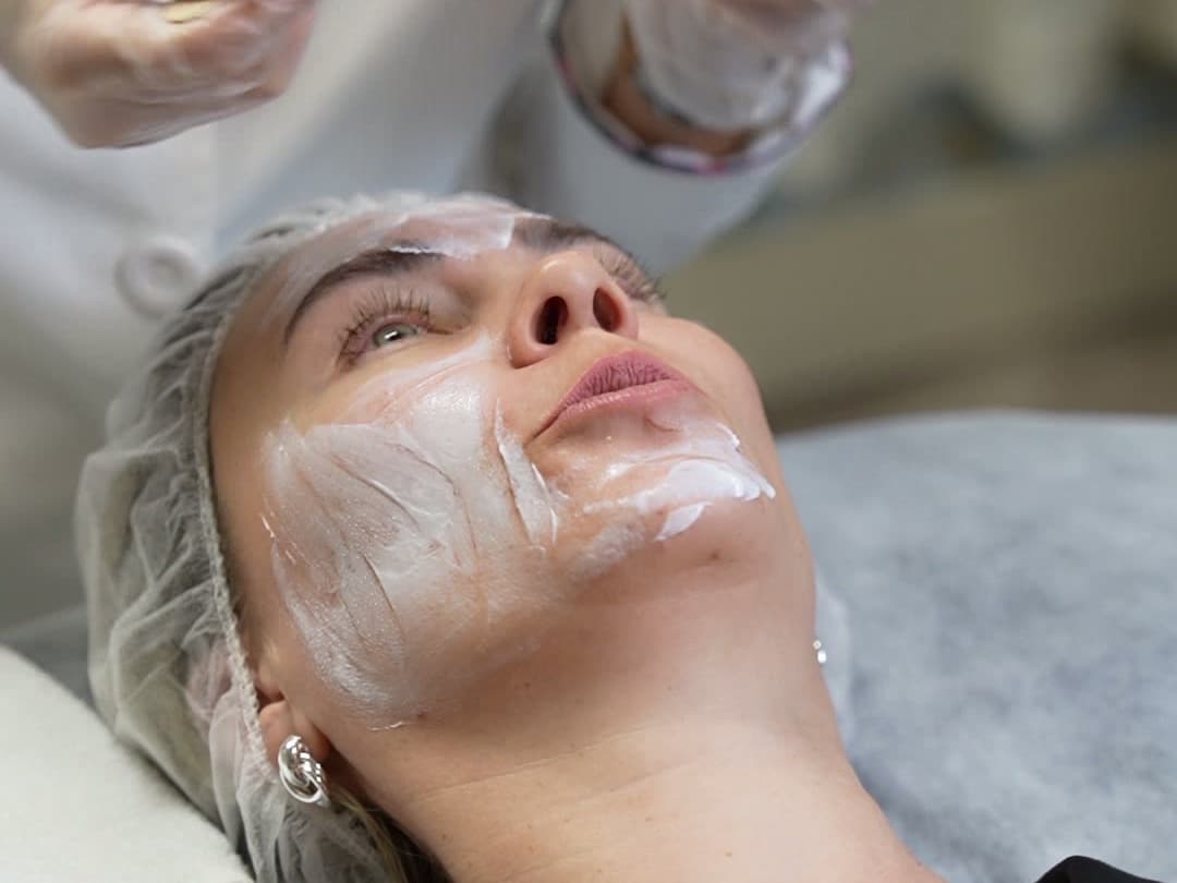 Licensed aesthetician applying a chemical peel at LNO Boutique med spa in Centennial, Denver