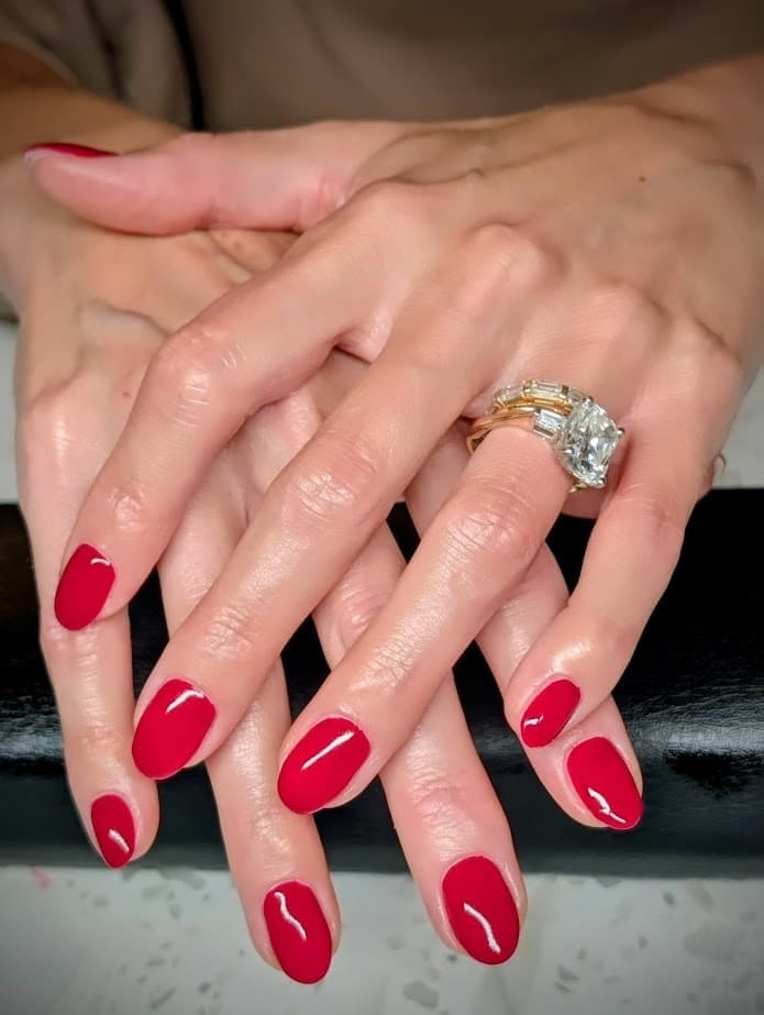 Russian manicure result with red gel polish at LNO Boutique in Centennial